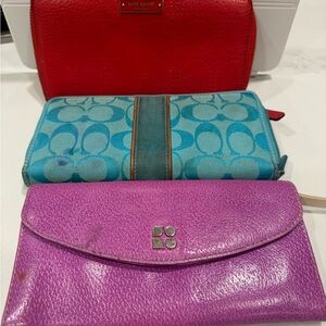 THREE wallets- two Kate Spade and one Coach